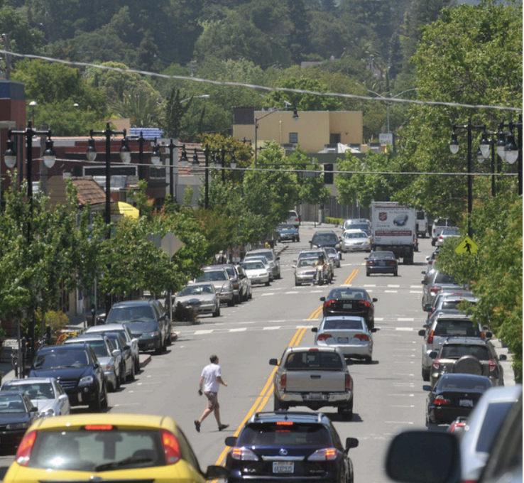 roadway with cars showing large pavement area